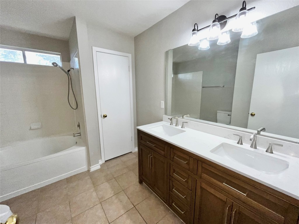 206 Presidio Drive Leander, TX 78641 - Photo 5 of 14 a spacious bathroom with a tub sink shower and mirror