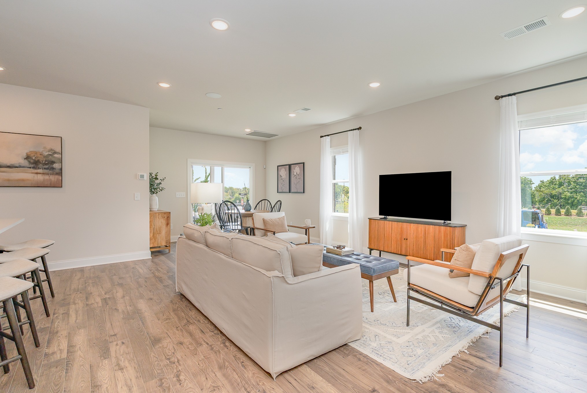 1073 Wrights Mill Road, Unit H7 Spring Hill, TN 37174 - Photo 7 of 43 a living room with furniture and a flat screen tv