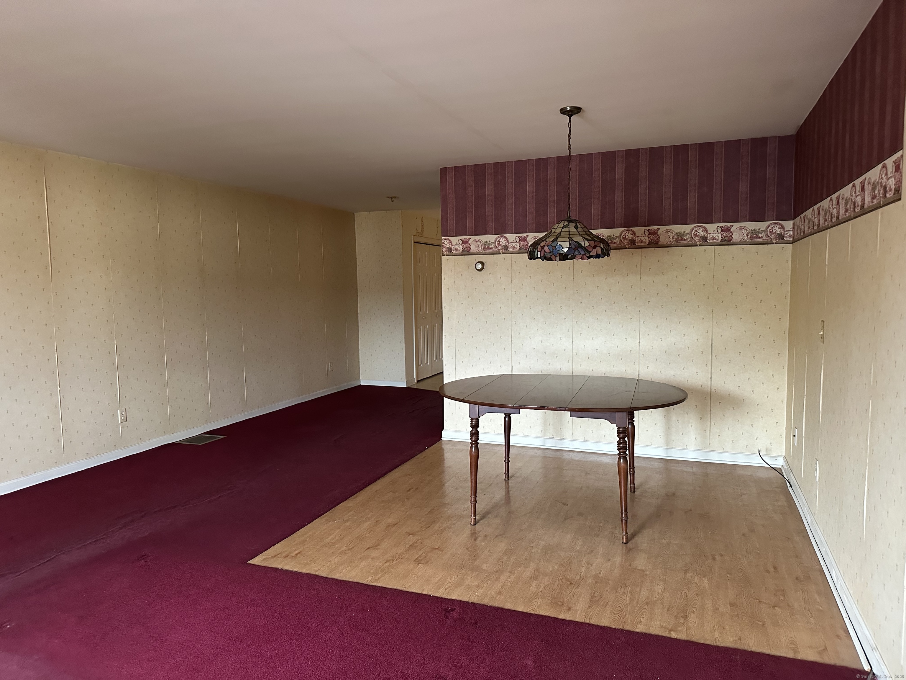 7 Howard Avenue, Unit 3 Ansonia, CT 06401 - Photo 6 of 15 a view of kitchen furniture and wooden floor