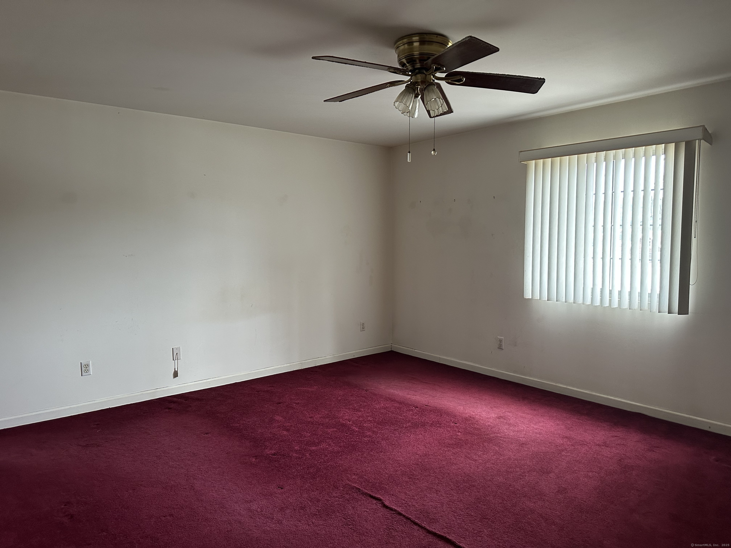 7 Howard Avenue, Unit 3 Ansonia, CT 06401 - Photo 7 of 15 an empty room with a window and a fan