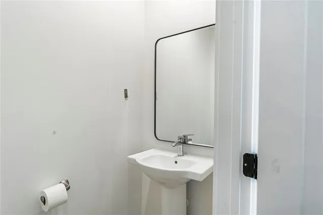 a bedroom with a bed and a bathroom