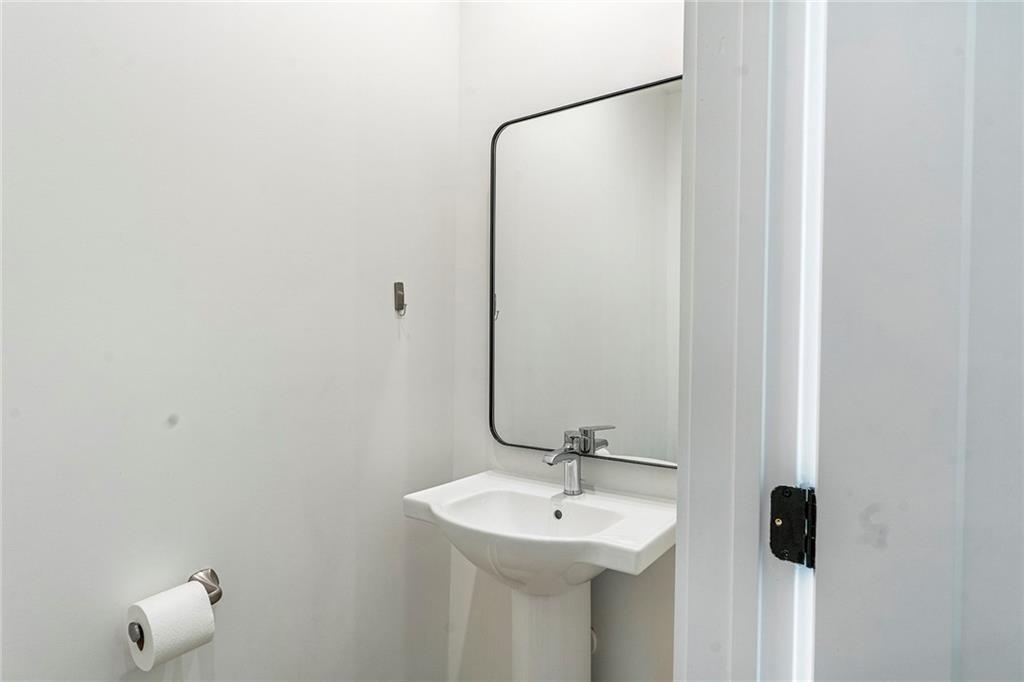 230 New Street, Unit 1201 Decatur, GA 30030 - Photo 17 of 29 a bathroom with a sink and mirror