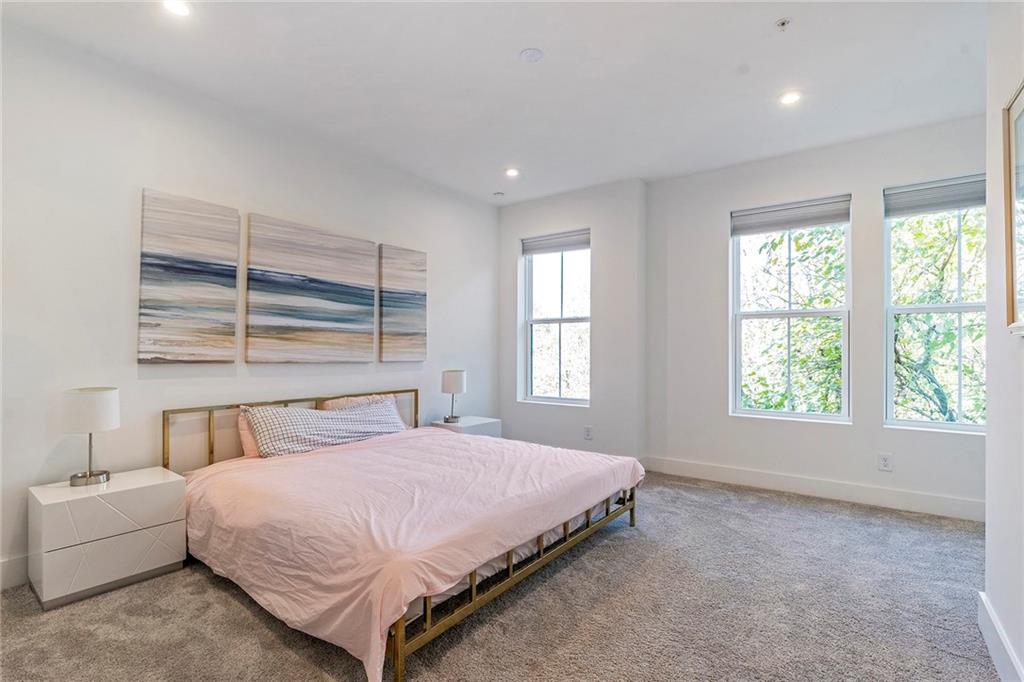 230 New Street, Unit 1201 Decatur, GA 30030 - Photo 18 of 29 a bedroom with a bed and window