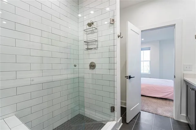 a bedroom with a bed and hallway