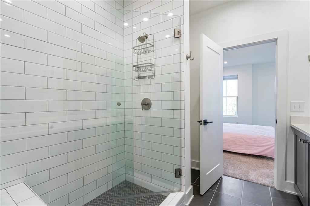230 New Street, Unit 1201 Decatur, GA 30030 - Photo 22 of 29 a bathroom with a shower