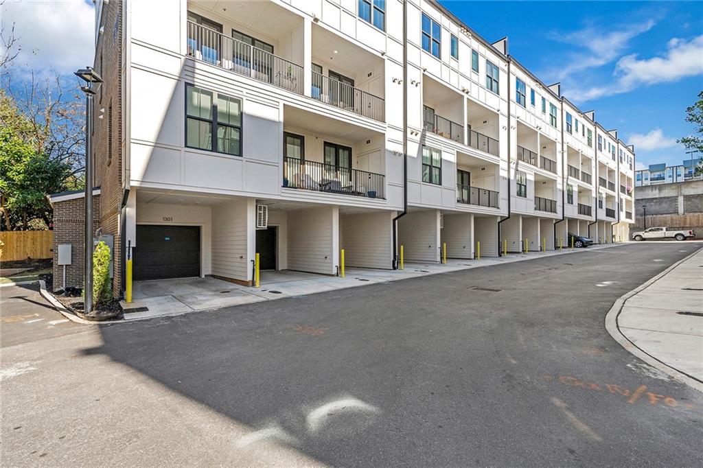 230 New Street, Unit 1201 Decatur, GA 30030 - Photo 26 of 29 a view of a building with a street