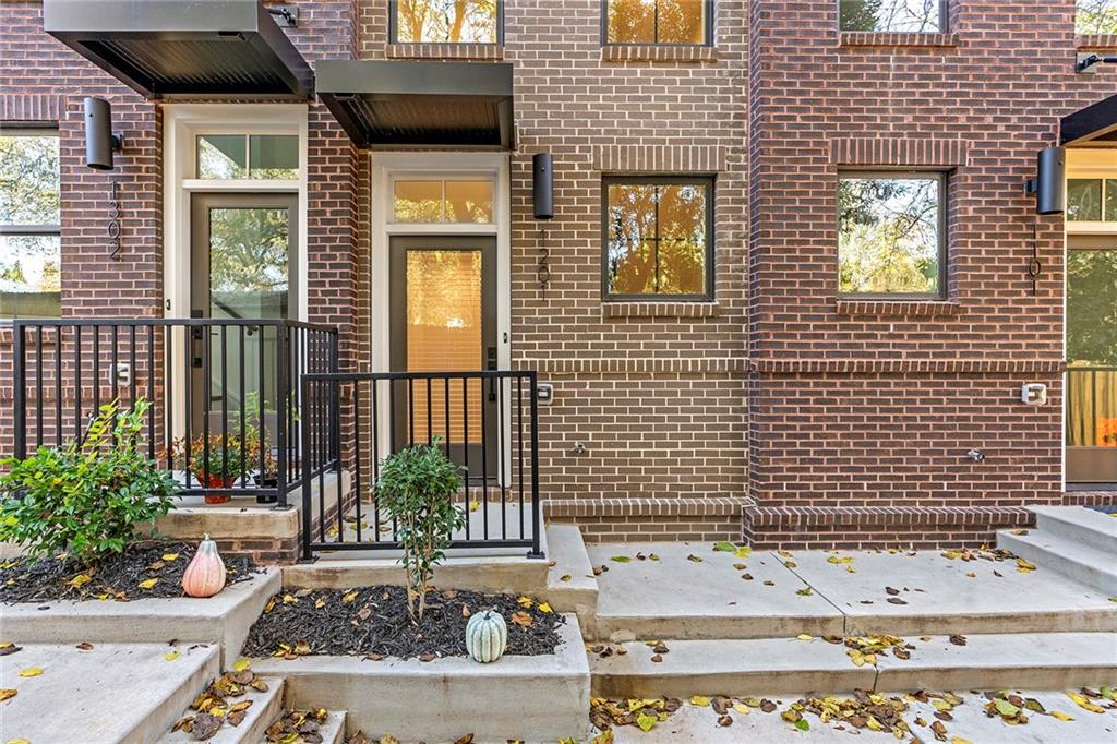 230 New Street, Unit 1201 Decatur, GA 30030 - Photo 27 of 29 a view of a brick house with a door and a window