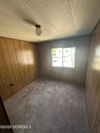 a view of an empty room with windows