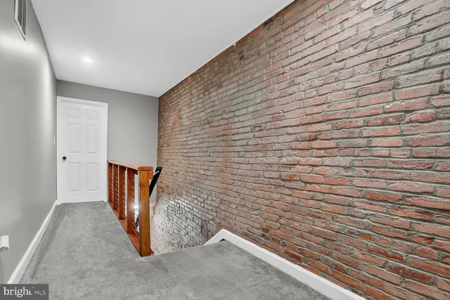 a view of a room with wooden walls