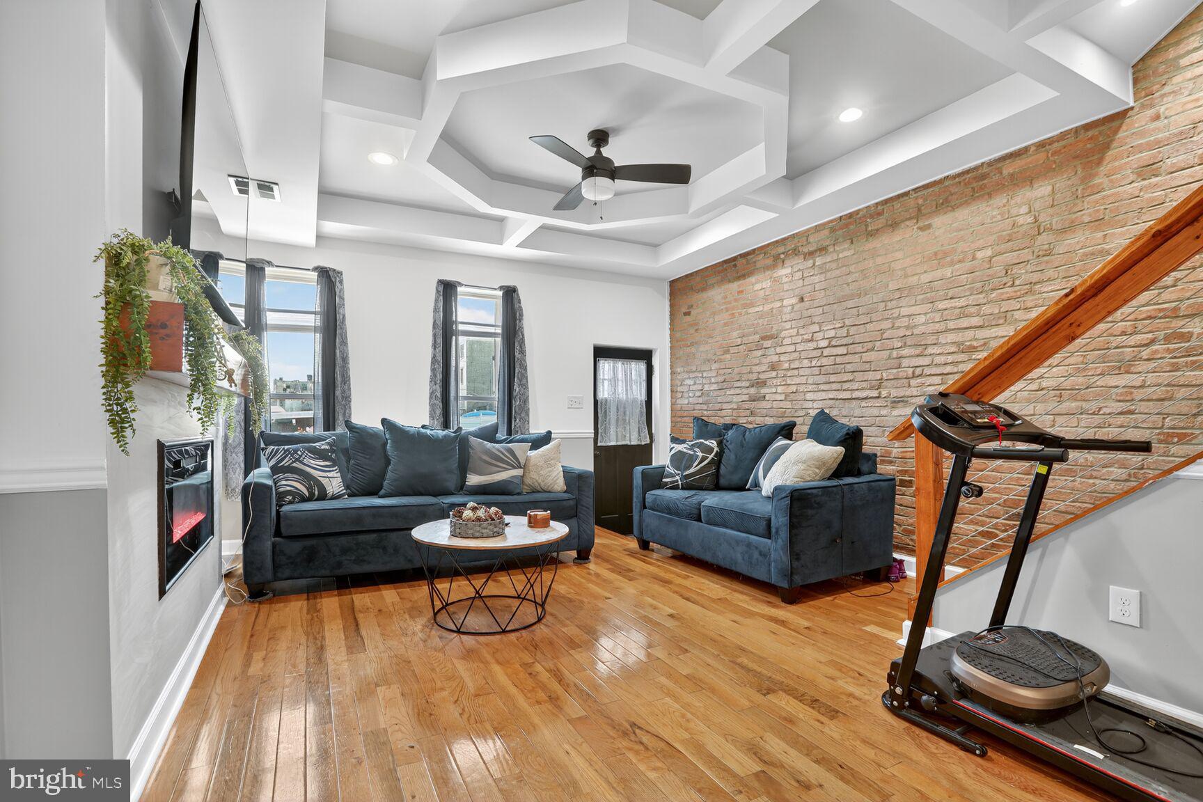 1502 East Hoffman Street Baltimore, MD 21213 - Photo 2 of 30 a living room with furniture and a wooden floor