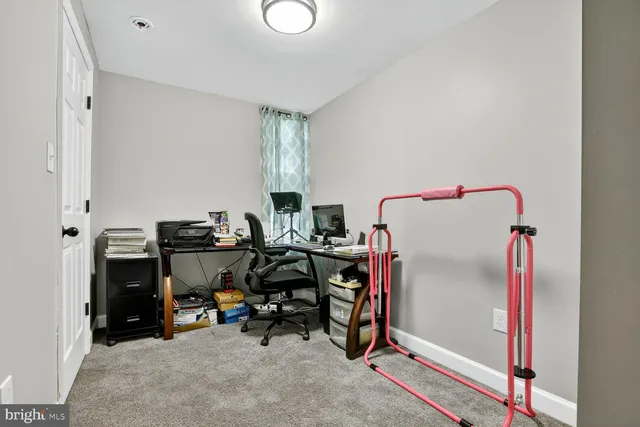 a view of a workspace with furniture