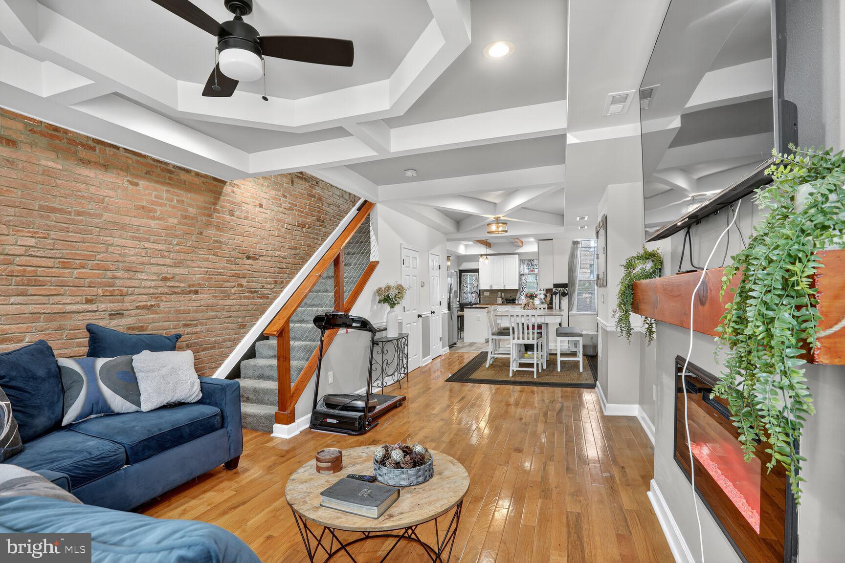 1502 East Hoffman Street Baltimore, MD 21213 - Photo 3 of 30 a living room with furniture and wooden floor