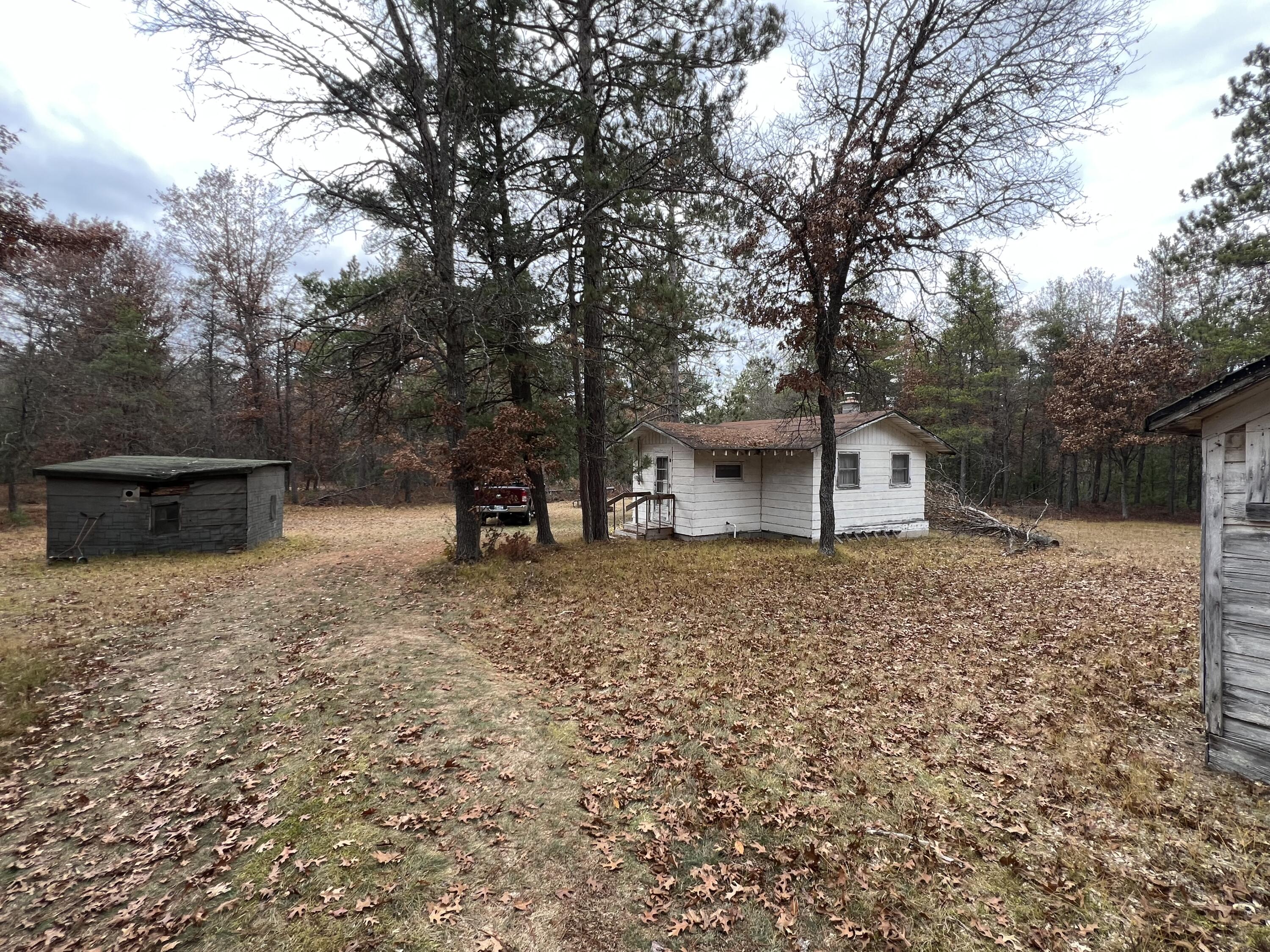4066 Palmer Road Luzerne, MI 48636 - Photo 2 of 13 View of cabin and shed.