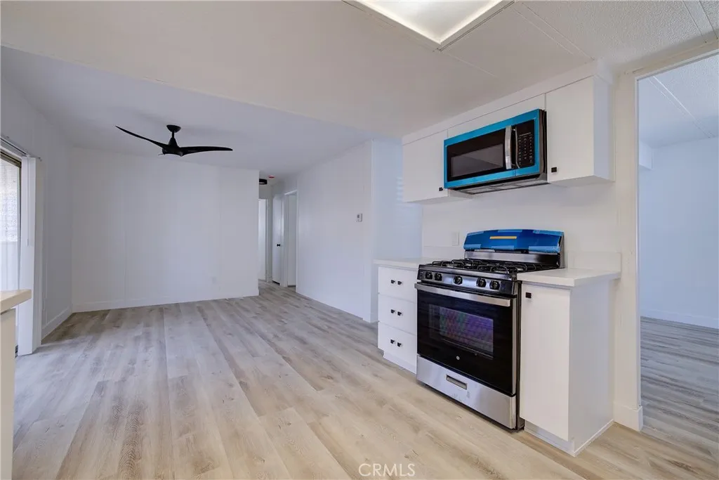 3700 Buchanan Street, Unit 164 Riverside, CA 92503 - Photo 11 of 40 a kitchen with a stove and a microwave