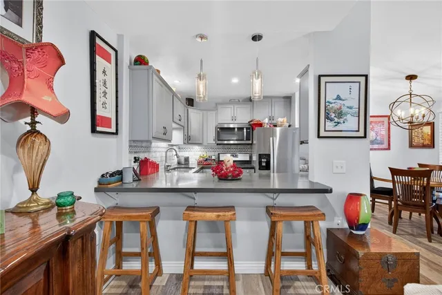 a dining room with furniture and wooden floor