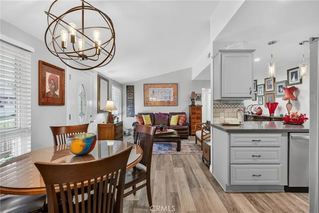 a view of a dining room with furniture wooden floor and front door