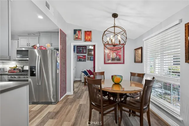 a kitchen with cabinets appliances and a sink