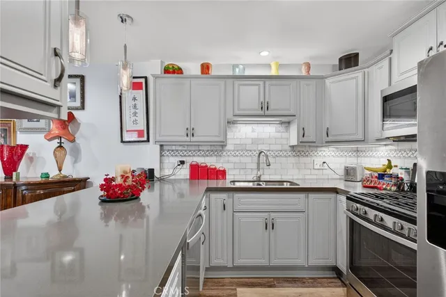 a bedroom with furniture and a flat screen tv