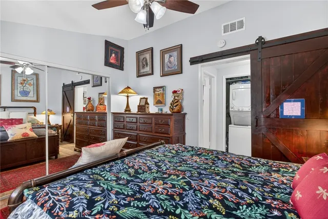 a living room with furniture and book shelf