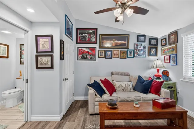 a white toilet sitting next to a bathroom sink