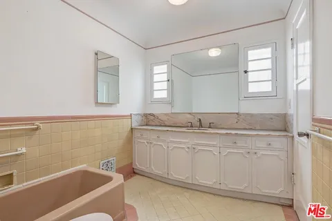 a front view of building with a yard