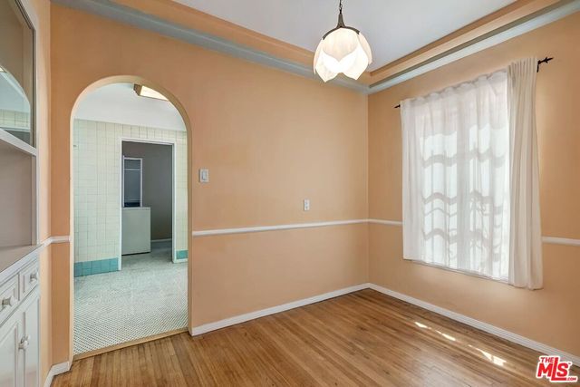 a bedroom with bed and window