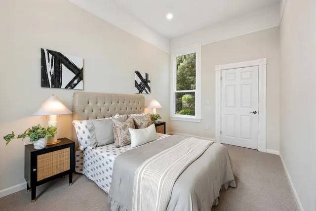 a bedroom with bed and a window