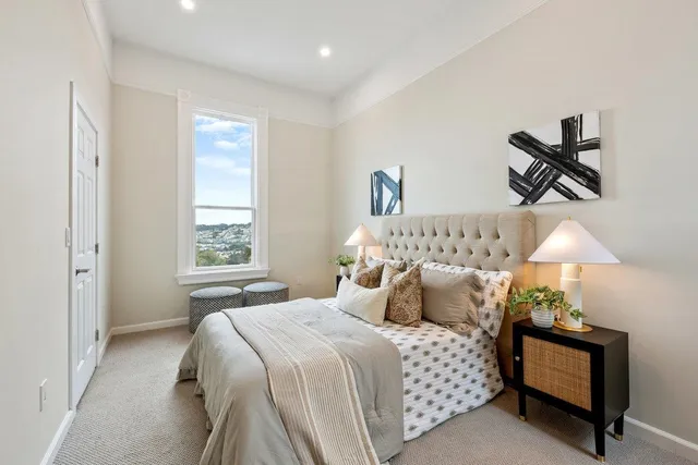 a bedroom with bed and a window