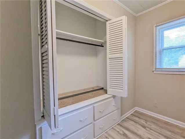 a view of a closet in the kitchen