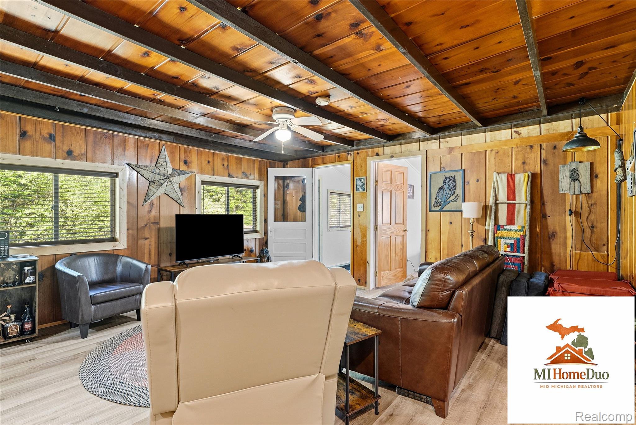 6960 Rumsay Street Harrison, MI 48625 - Photo 19 of 29 Vaulted wood-paneled ceiling with exposed beams