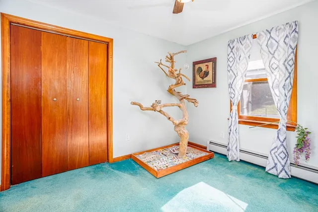 a room with lots of furniture and a flat screen tv