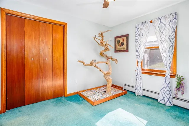 a room with lots of furniture and a flat screen tv