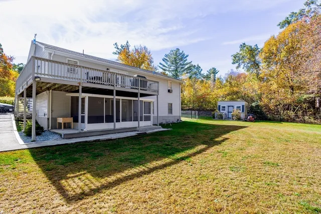a front view of house with yard patio and green space