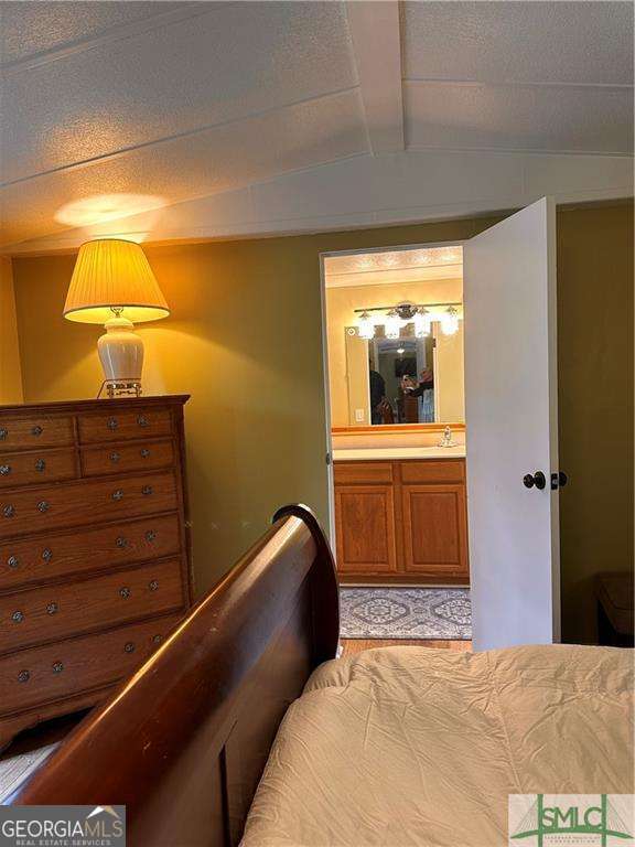 219 John Carter Road Bloomingdale, GA 31302 - Photo 12 of 28 a bedroom with a bed and a window