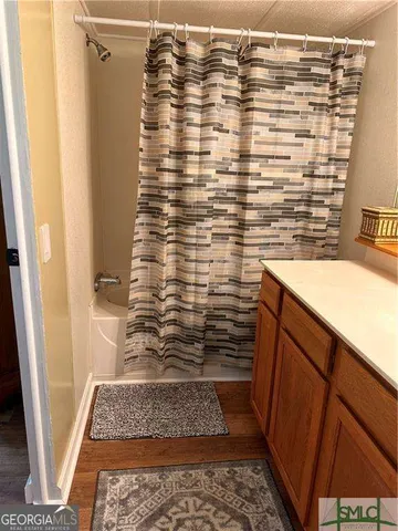 a bathroom with a sink and a shower