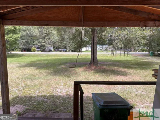 a view of a porch with a yard