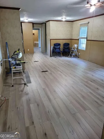 a view of a livingroom with furniture and a fireplace
