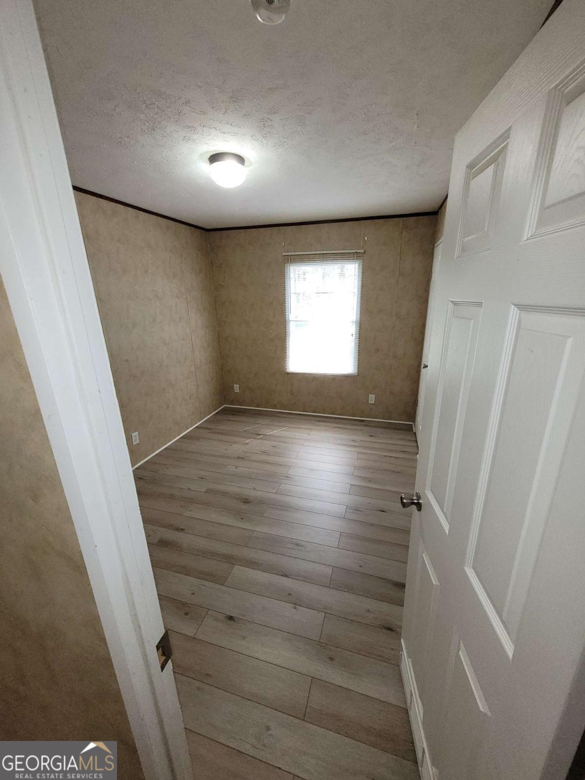 219 John Carter Road Bloomingdale, GA 31302 - Photo 18 of 28 a view of hallway with stairs and wooden floor