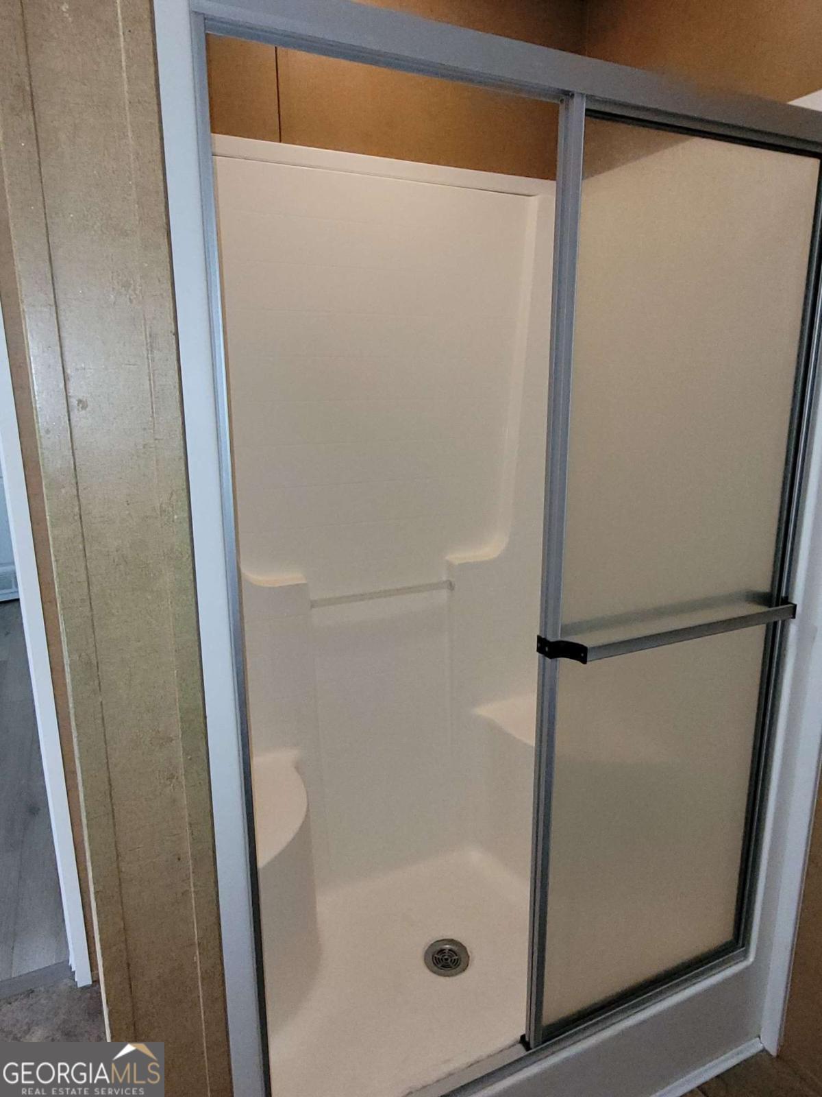 219 John Carter Road Bloomingdale, GA 31302 - Photo 24 of 28 a bathroom with a glass shower door