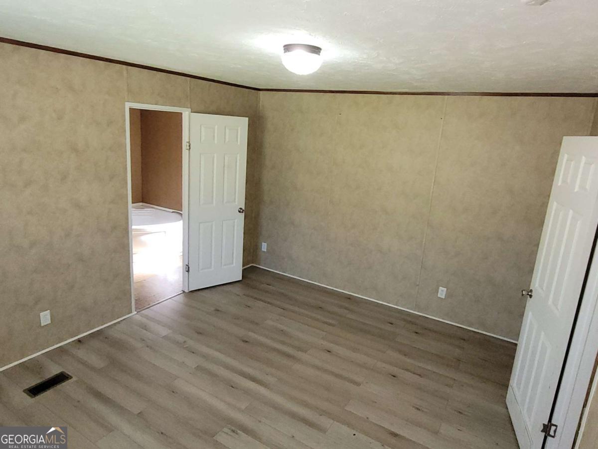 219 John Carter Road Bloomingdale, GA 31302 - Photo 26 of 28 a view of a livingroom with wooden floor