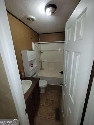 a bathroom with a sink and toilet