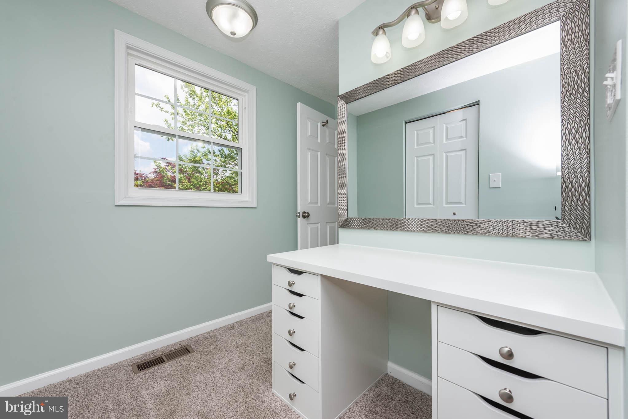 7674 Tuckerman Drive Hanover, MD 21076 - Photo 18 of 45 a room with cabinets and window