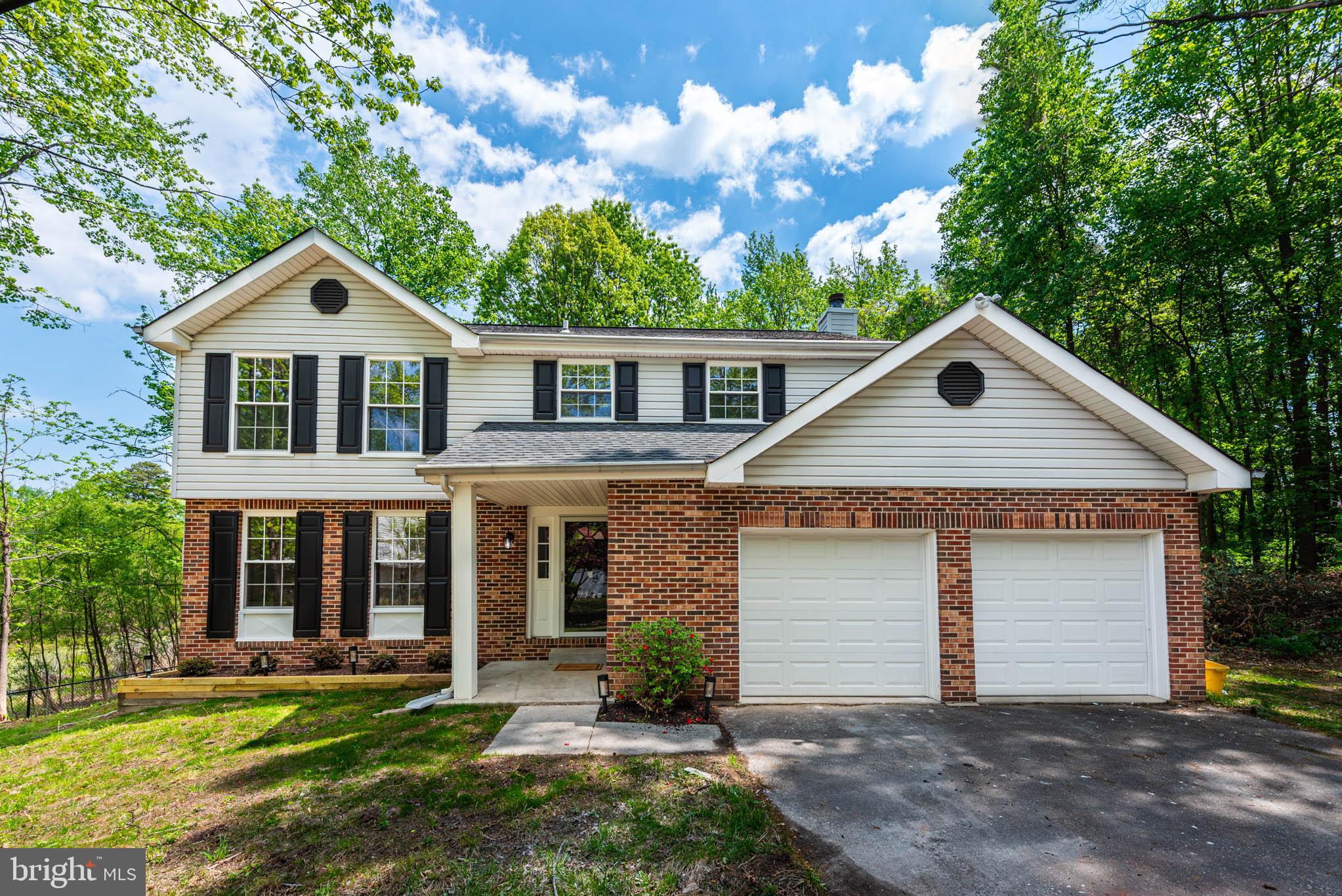 7674 Tuckerman Drive Hanover, MD 21076 - Photo 31 of 45 front view of a house with a yard