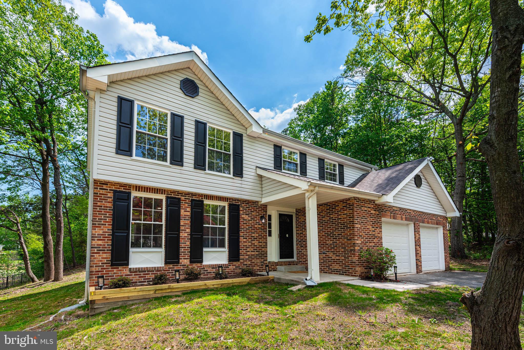 7674 Tuckerman Drive Hanover, MD 21076 - Photo 32 of 45 front view of a house with a yard