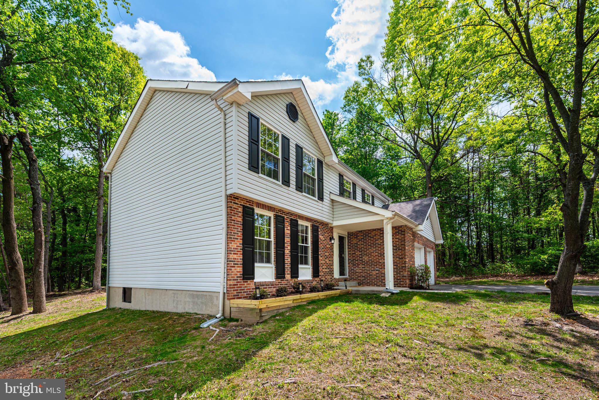 7674 Tuckerman Drive Hanover, MD 21076 - Photo 34 of 45 a view of a house with a yard