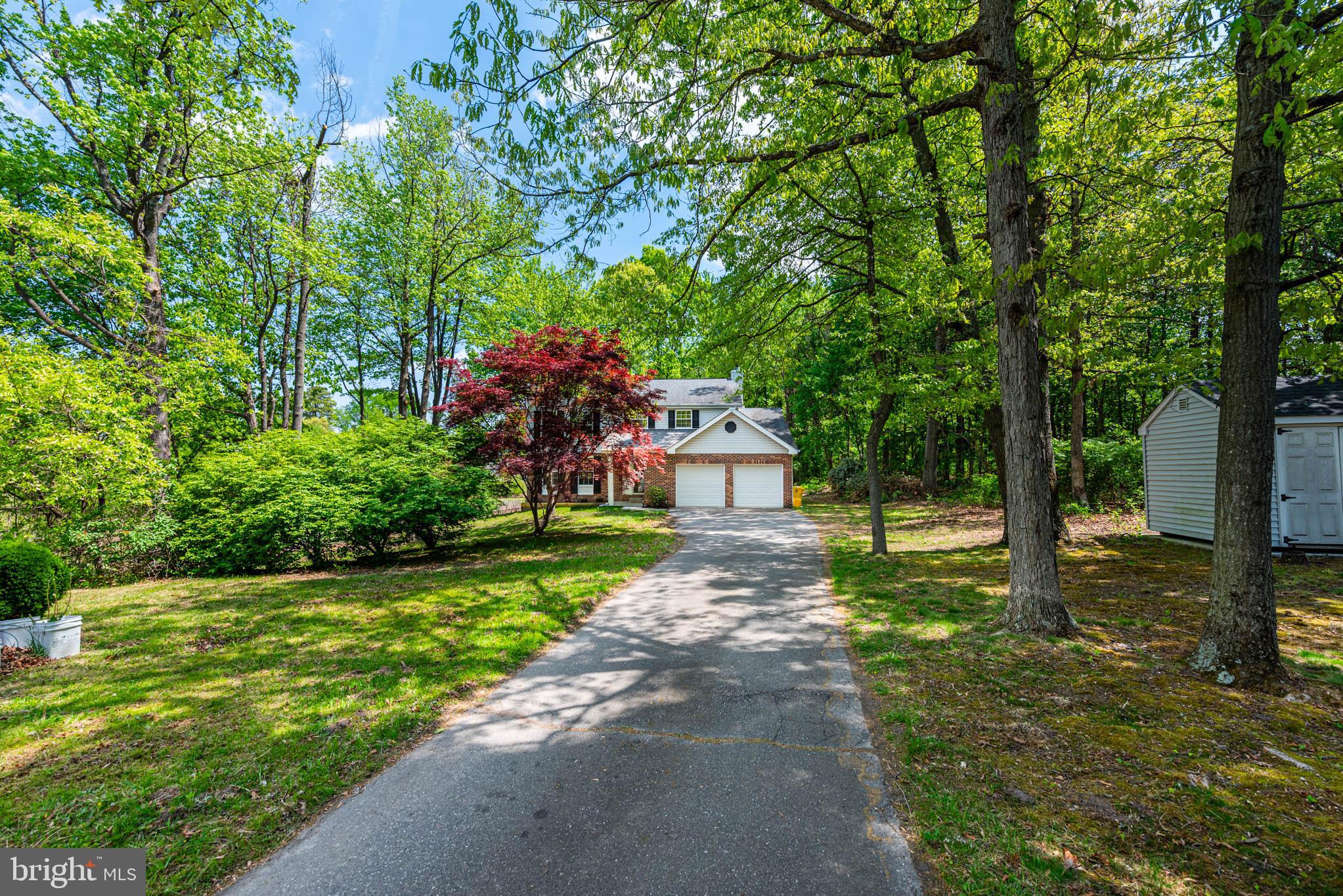 7674 Tuckerman Drive Hanover, MD 21076 - Photo 35 of 45 a view of a back yard with green space