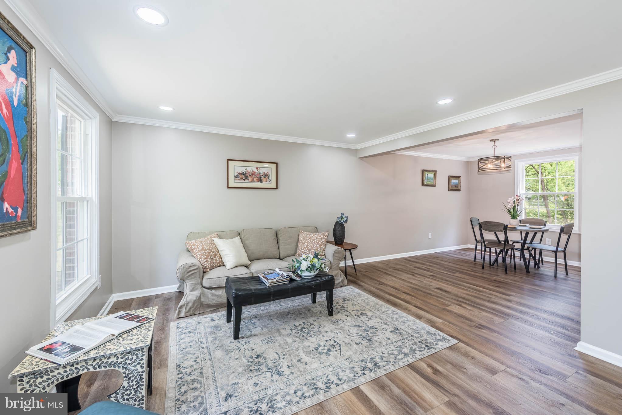 7674 Tuckerman Drive Hanover, MD 21076 - Photo 4 of 45 a living room with furniture and a rug