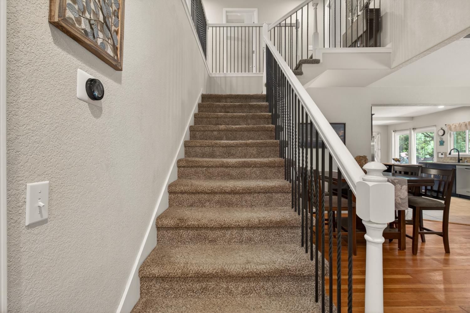 6332 Horseshoe Bar Road Loomis, CA 95650 - Photo 23 of 85 Carpeted staircase with white balustrade and black metal spindles