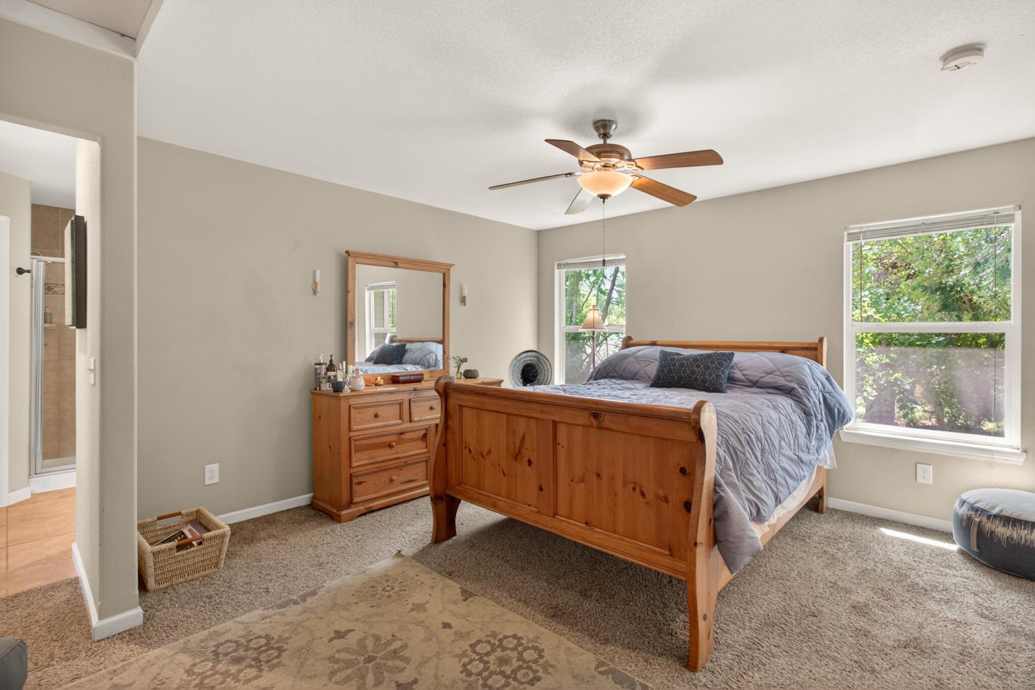 6332 Horseshoe Bar Road Loomis, CA 95650 - Photo 34 of 85 Carpeted room featuring multiple windows with tree-lined exterior views