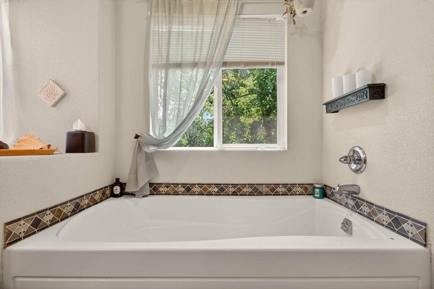 6332 Horseshoe Bar Road Loomis, CA 95650 - Photo 42 of 85 Built-in soaking tub featuring decorative tile surround and chrome fixtures